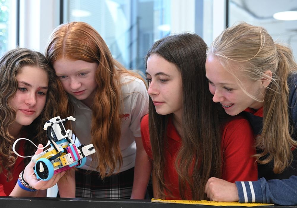 middle school students with robotics