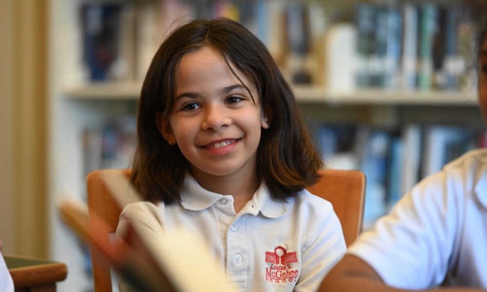 lower school student in library