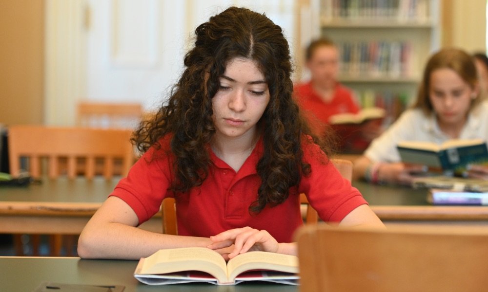 upper school student in library